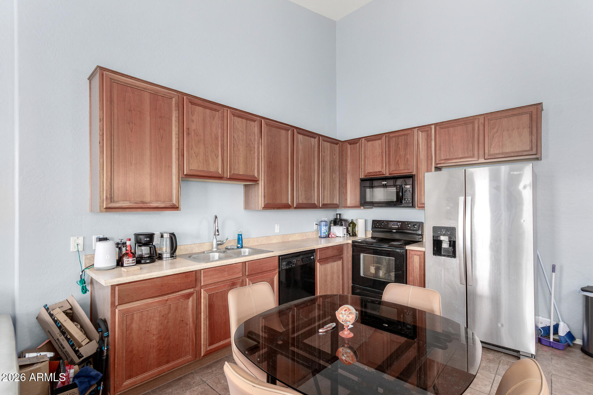 2257 East Huntington Drive Phoenix, AZ 85040 - Photo 13 of 25 a kitchen with stainless steel appliances granite countertop a refrigerator stove microwave and sink