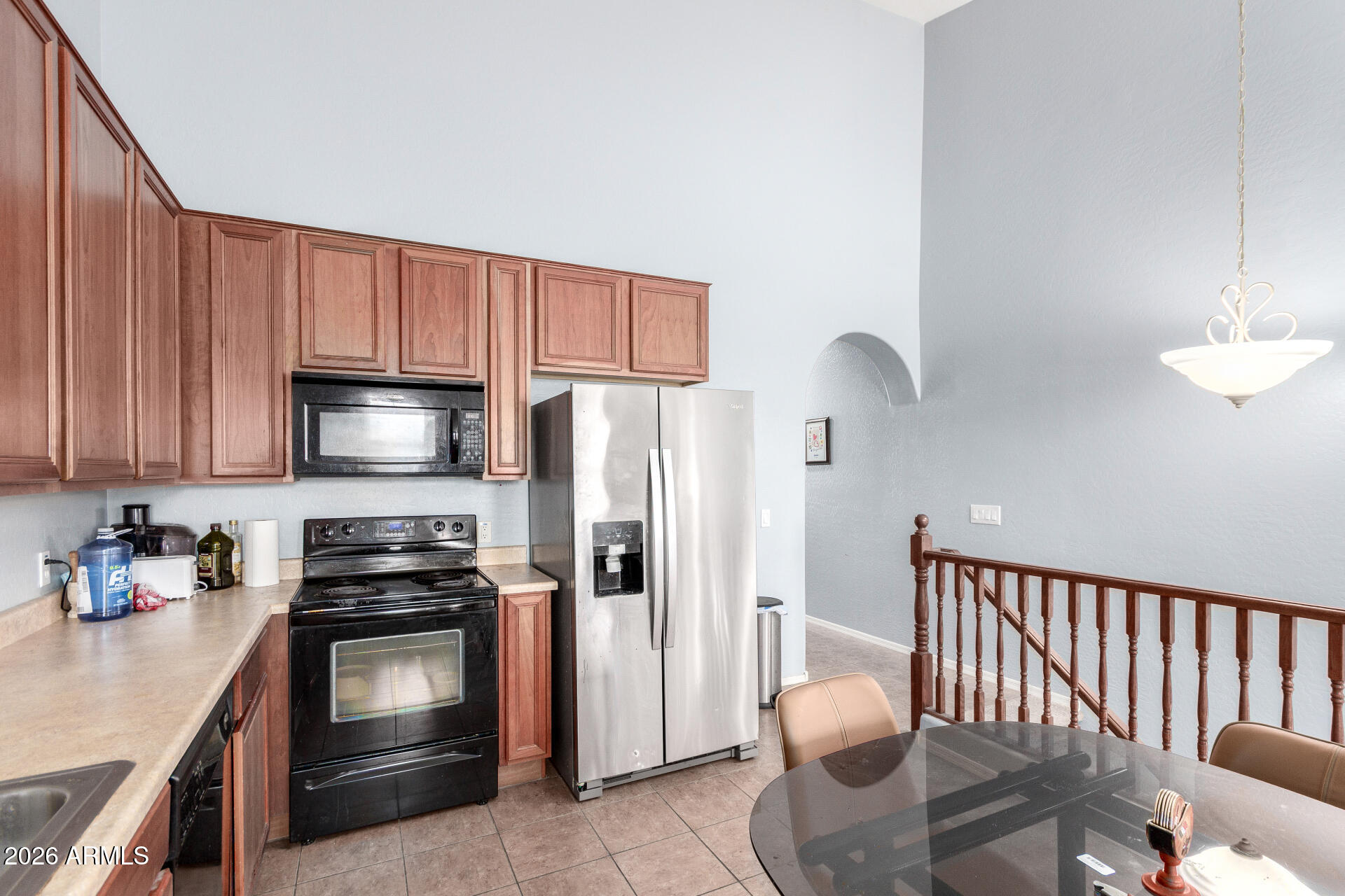 2257 East Huntington Drive Phoenix, AZ 85040 - Photo 14 of 25 a kitchen with stainless steel appliances granite countertop a refrigerator stove microwave and sink