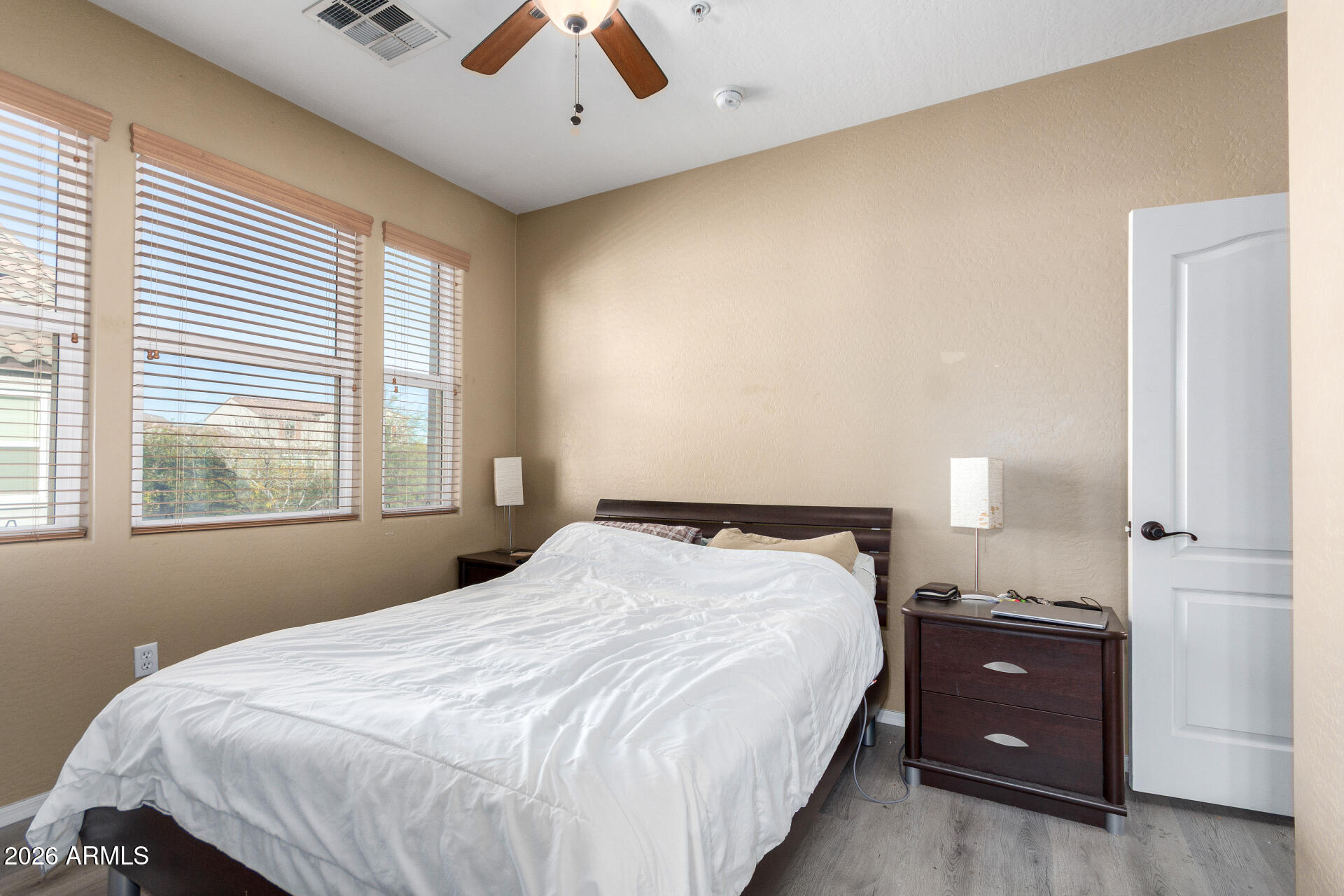 2257 East Huntington Drive Phoenix, AZ 85040 - Photo 16 of 25 a bedroom with a bed and a window