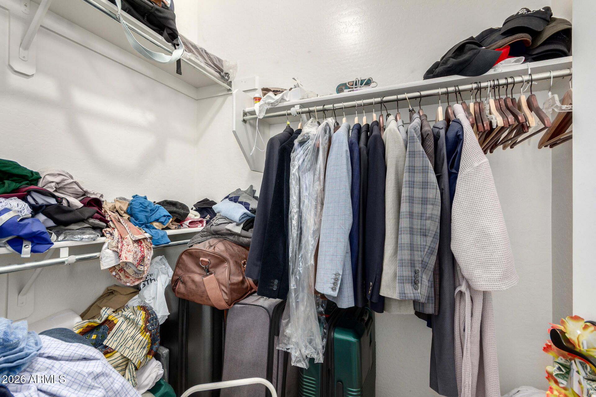2257 East Huntington Drive Phoenix, AZ 85040 - Photo 19 of 25 a view of walk in closet with clothes and shoes