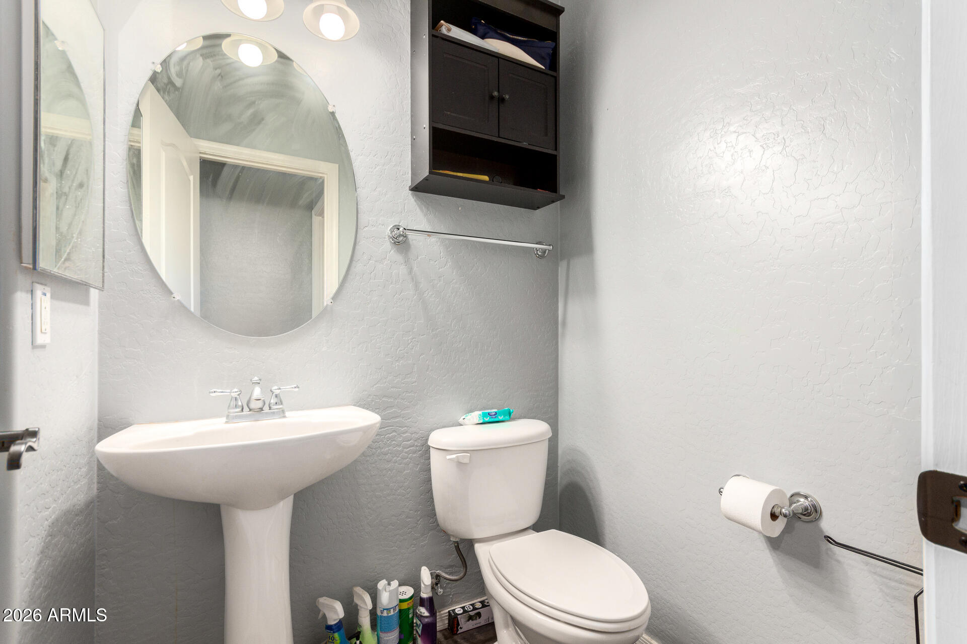 2257 East Huntington Drive Phoenix, AZ 85040 - Photo 22 of 25 a bathroom with a toilet sink and mirror