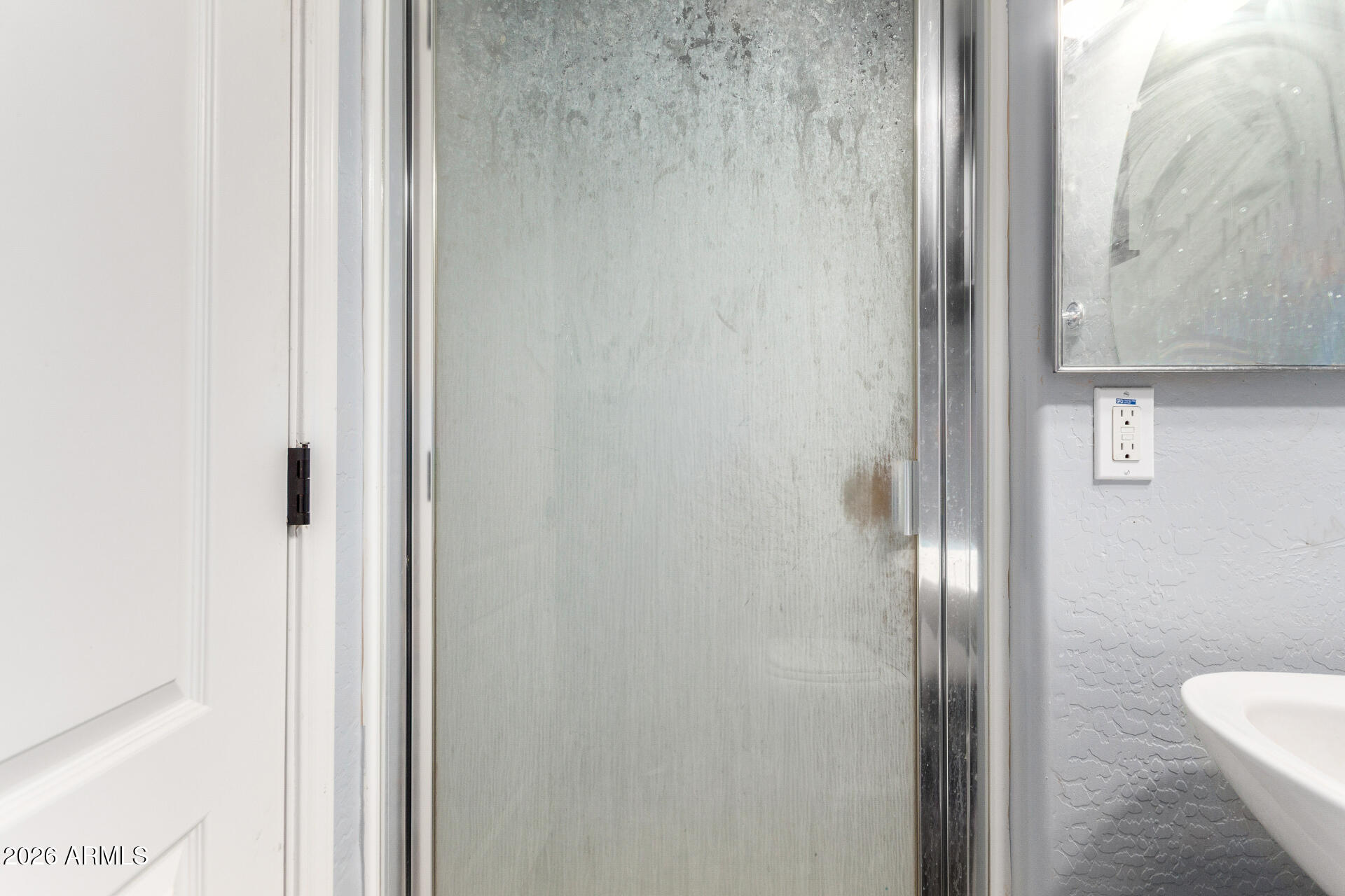 2257 East Huntington Drive Phoenix, AZ 85040 - Photo 23 of 25 a bathroom with a glass shower door