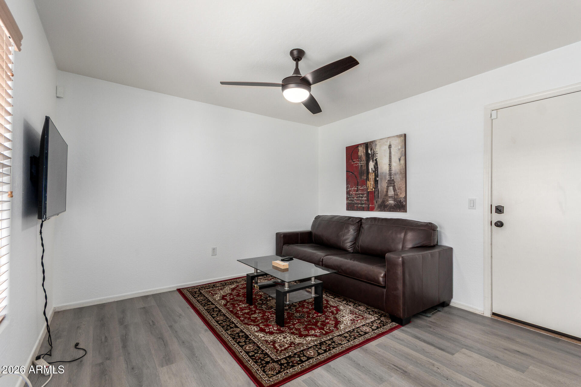 2257 East Huntington Drive Phoenix, AZ 85040 - Photo 6 of 25 a living room with furniture and a flat screen tv
