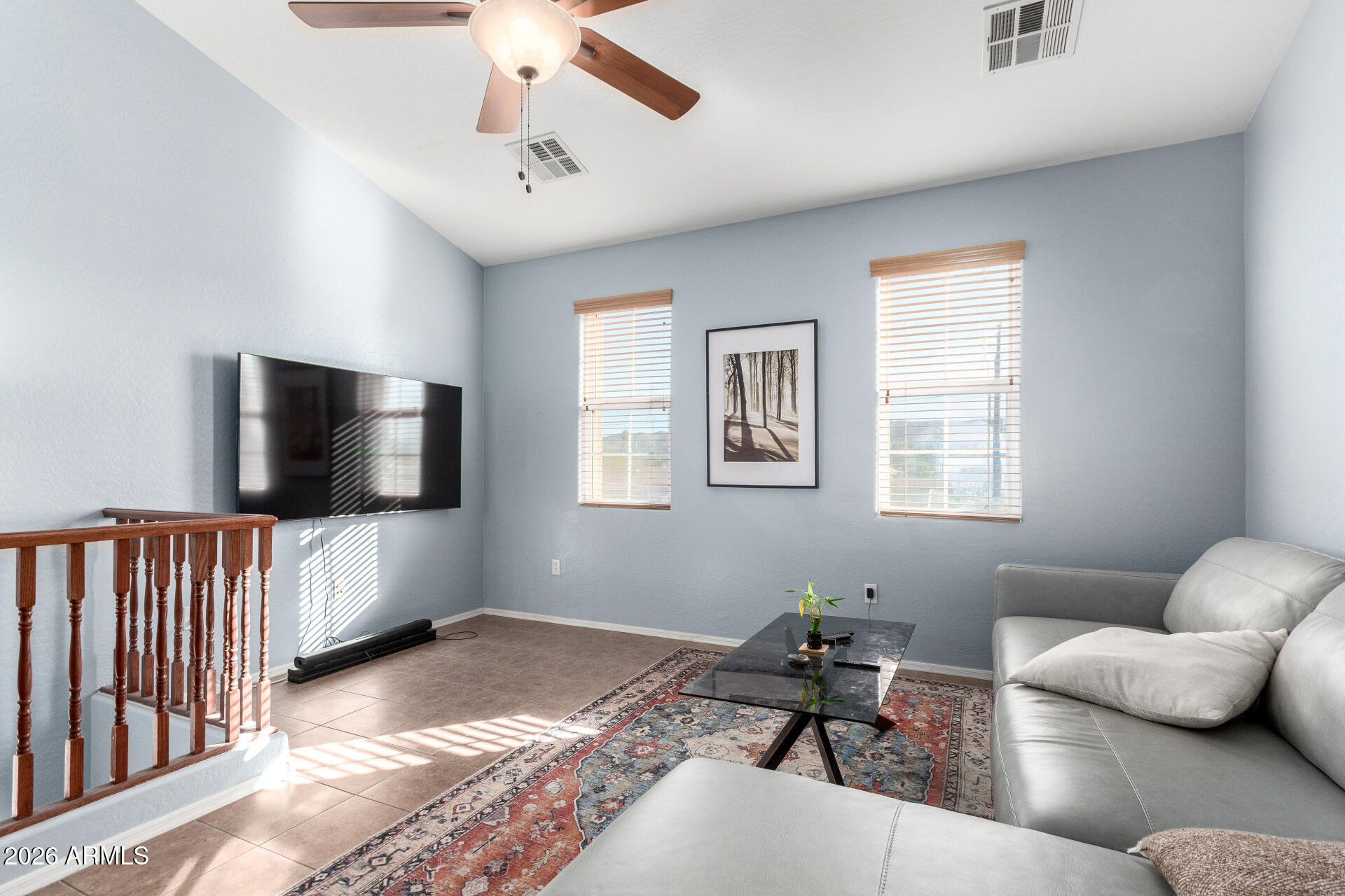 2257 East Huntington Drive Phoenix, AZ 85040 - Photo 10 of 25 a living room with furniture and a flat screen tv