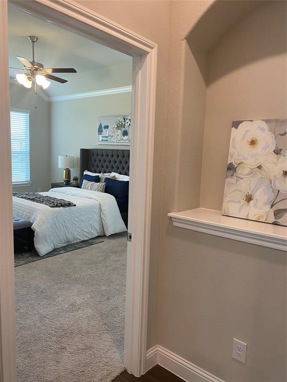209 Johnson Street Granbury, TX 76048 - Photo 31 of 40 Bedroom with carpet floors, ceiling fan, and crown molding