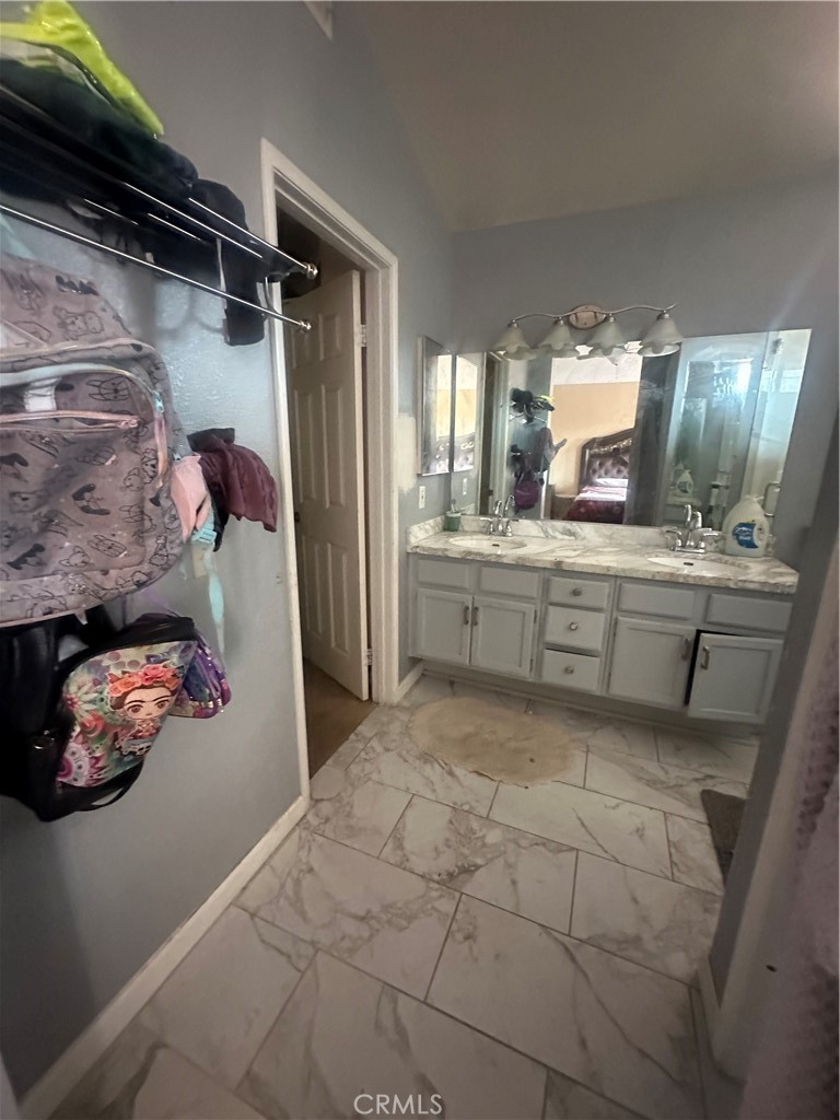 5147 Moonraker Road Palmdale, CA 93552 - Photo 13 of 21 a kitchen with stainless steel appliances granite countertop a refrigerator and a sink