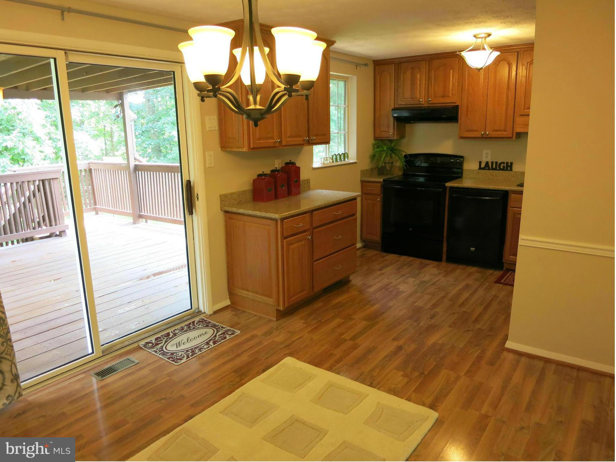 13705 Engleman Drive Laurel, MD 20708 - Photo 11 of 30 a kitchen with stainless steel appliances granite countertop a stove a sink and a refrigerator