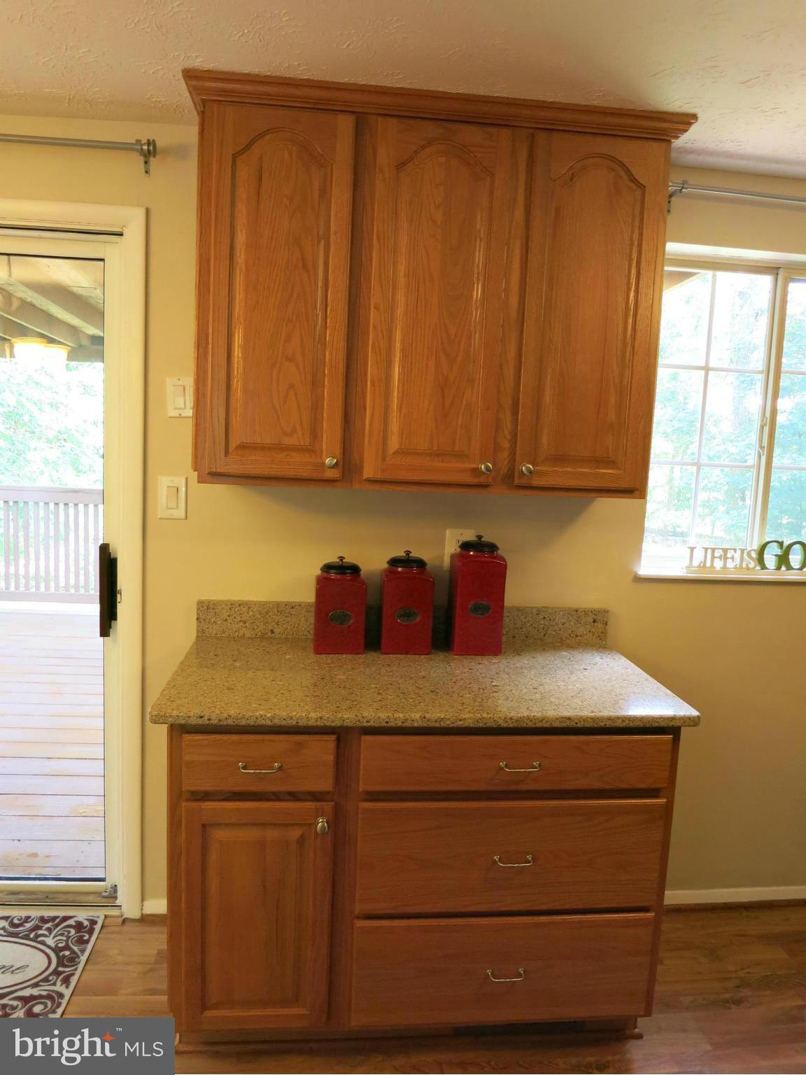 13705 Engleman Drive Laurel, MD 20708 - Photo 15 of 30 a view of cabinets with wooden floor