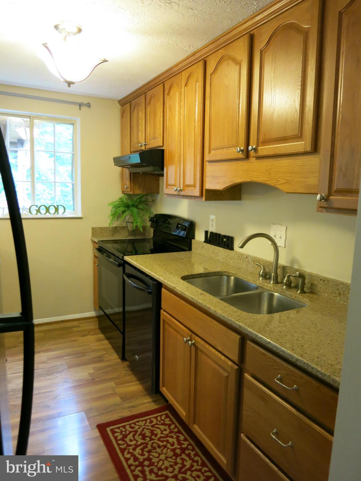 13705 Engleman Drive Laurel, MD 20708 - Photo 16 of 30 a kitchen with sink cabinets and window