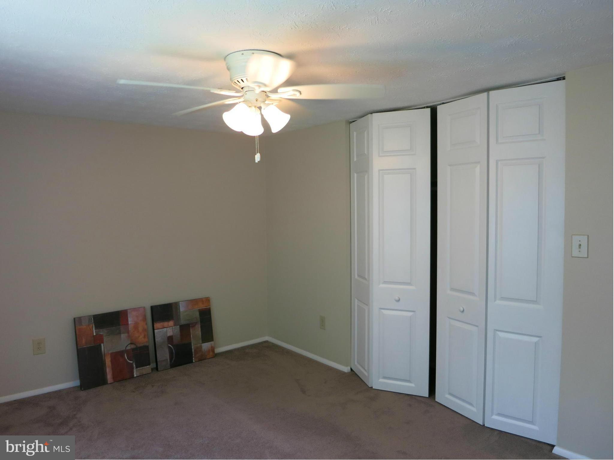 13705 Engleman Drive Laurel, MD 20708 - Photo 18 of 30 an empty room with a chandelier fan
