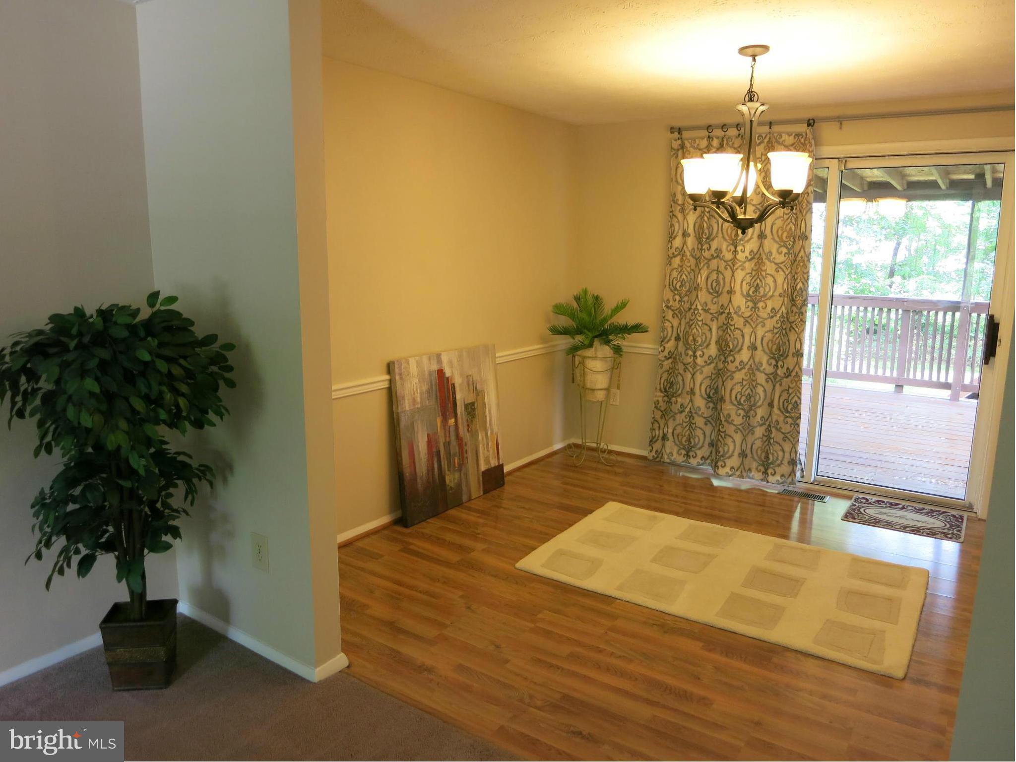 13705 Engleman Drive Laurel, MD 20708 - Photo 7 of 30 a bedroom with a bed and a potted plant