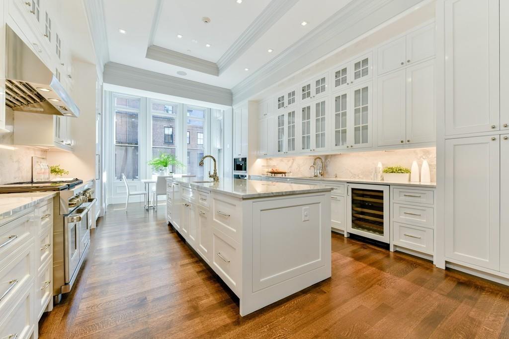 175 Beacon Street Boston, MA 02116 - Photo 15 of 35 a kitchen with stainless steel appliances a stove top oven a sink a refrigerator and white cabinets