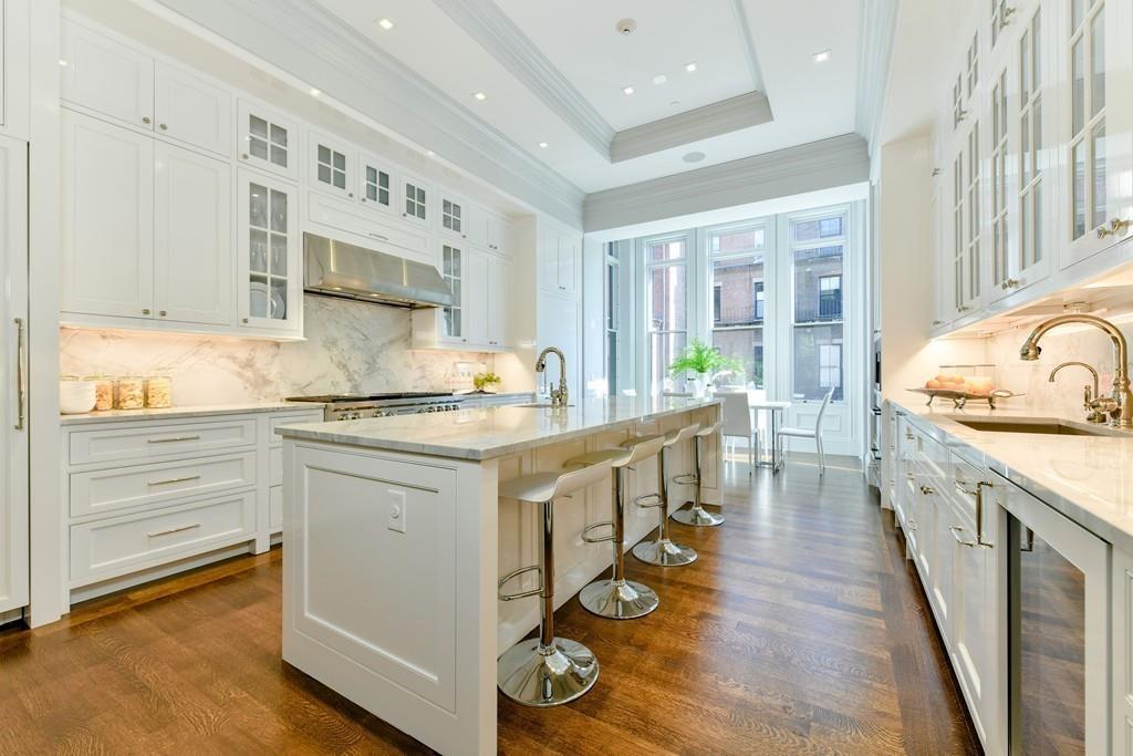 175 Beacon Street Boston, MA 02116 - Photo 16 of 35 a kitchen with sink stove and cabinets