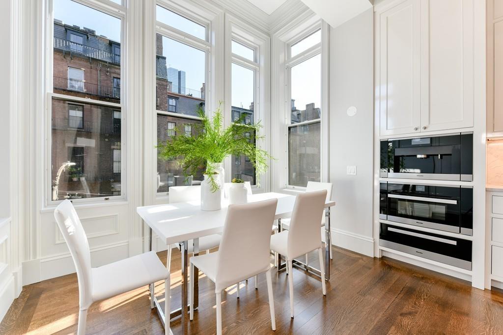 175 Beacon Street Boston, MA 02116 - Photo 17 of 35 a view of a dining room with furniture window and wooden floor
