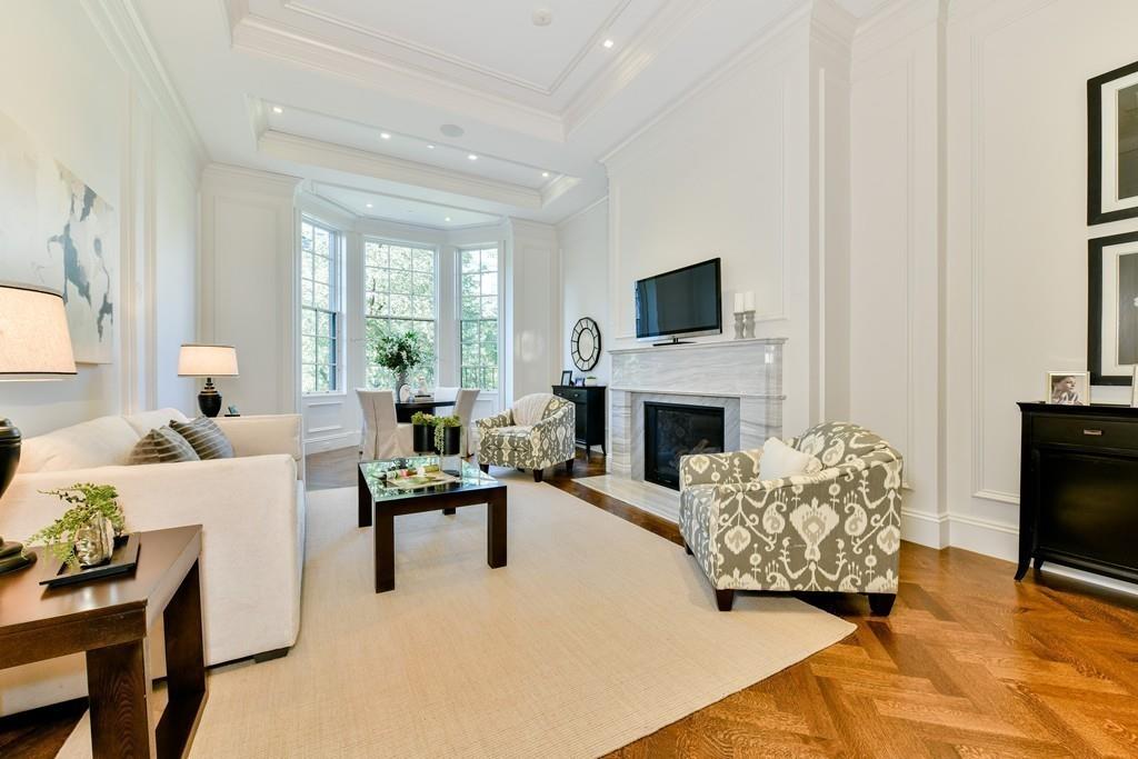 175 Beacon Street Boston, MA 02116 - Photo 19 of 35 a living room with furniture a flat screen tv and a fireplace