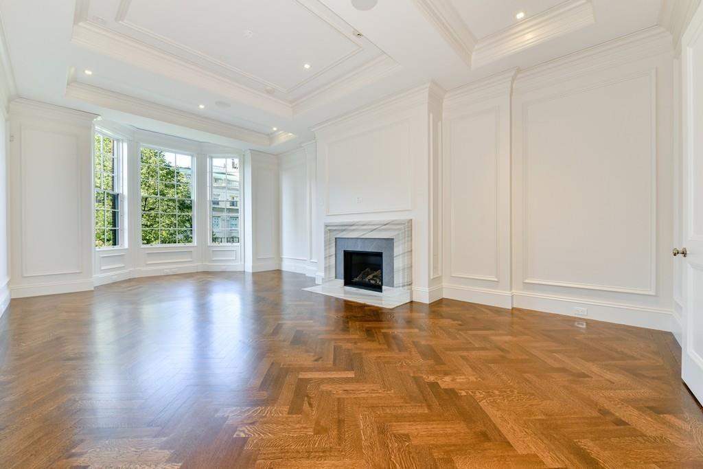 175 Beacon Street Boston, MA 02116 - Photo 21 of 35 a view of empty room with wooden floor and fireplace