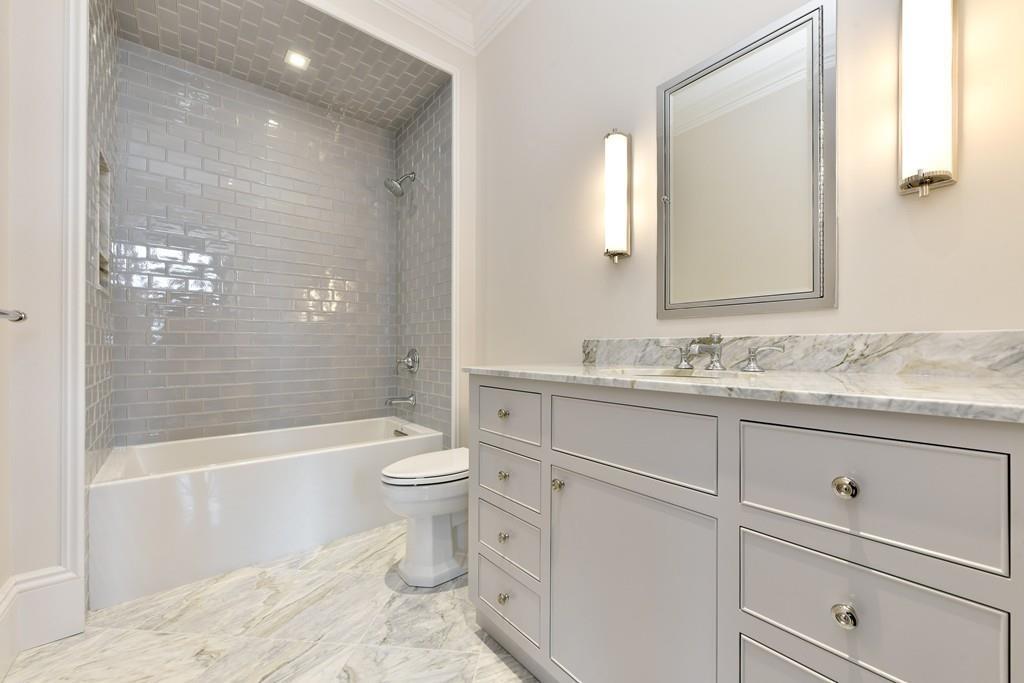 175 Beacon Street Boston, MA 02116 - Photo 26 of 35 a bathroom with a granite countertop toilet a sink and bathtub