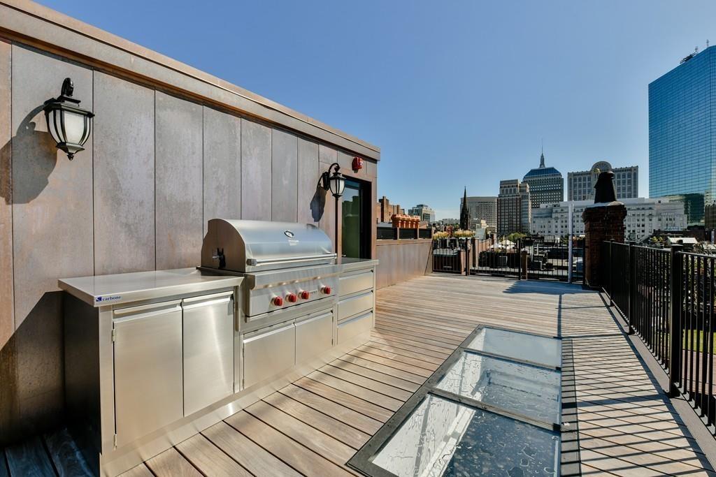175 Beacon Street Boston, MA 02116 - Photo 29 of 35 a living room with furniture and a fireplace