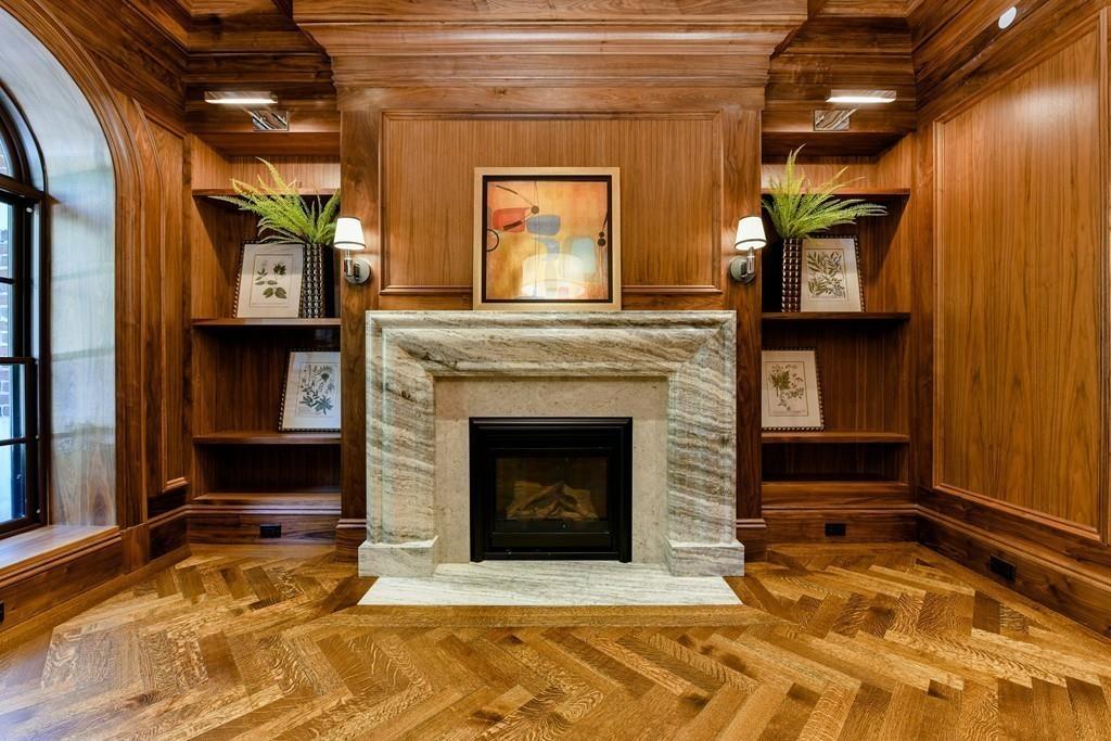 175 Beacon Street Boston, MA 02116 - Photo 7 of 35 a living room with a fireplace in it