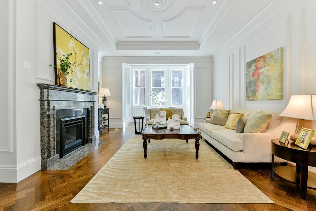 175 Beacon Street Boston, MA 02116 - Photo 10 of 35 a living room with furniture and a fireplace