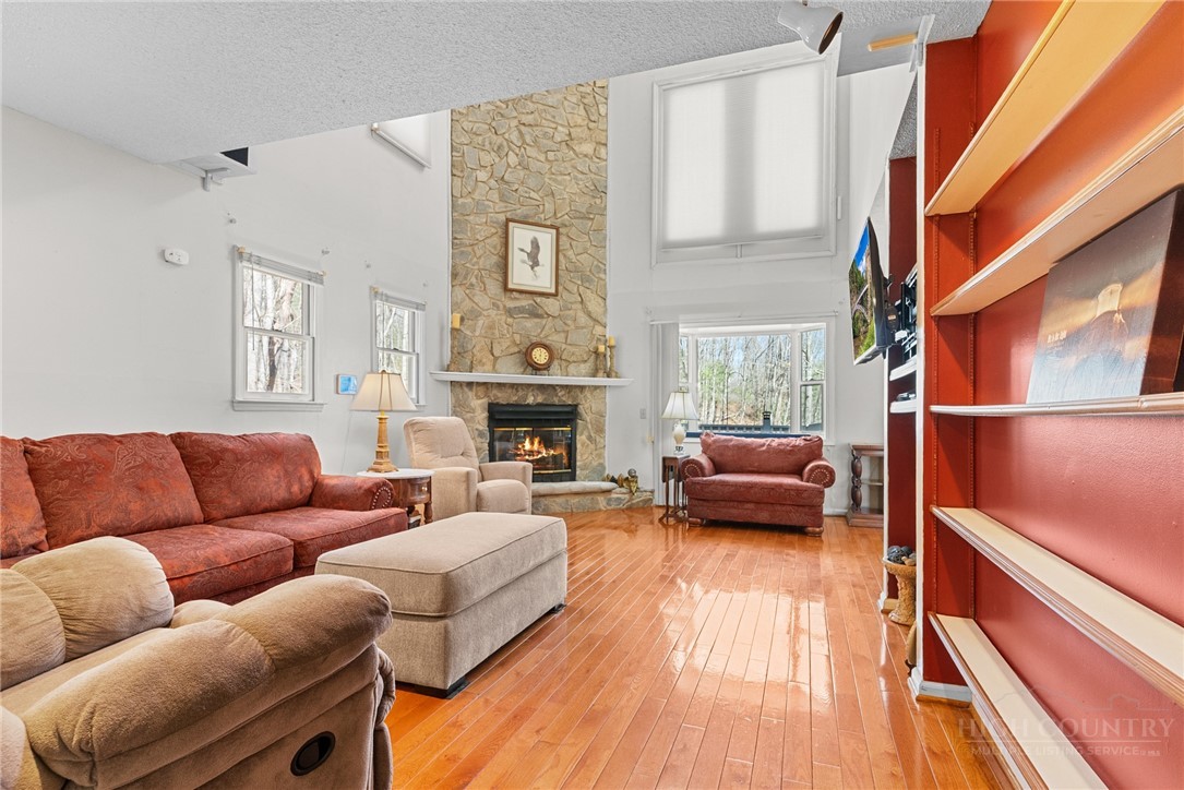 271 Quail Hollow Road Crumpler, NC 28617 - Photo 10 of 30 a living room with furniture and a fireplace