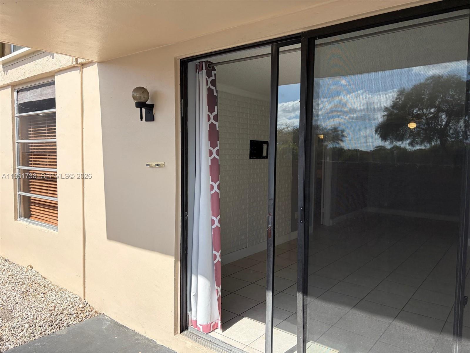 13781 Southwest 66th Street, Unit 129B Miami, FL 33183 - Photo 6 of 24 Patio area - sliding door