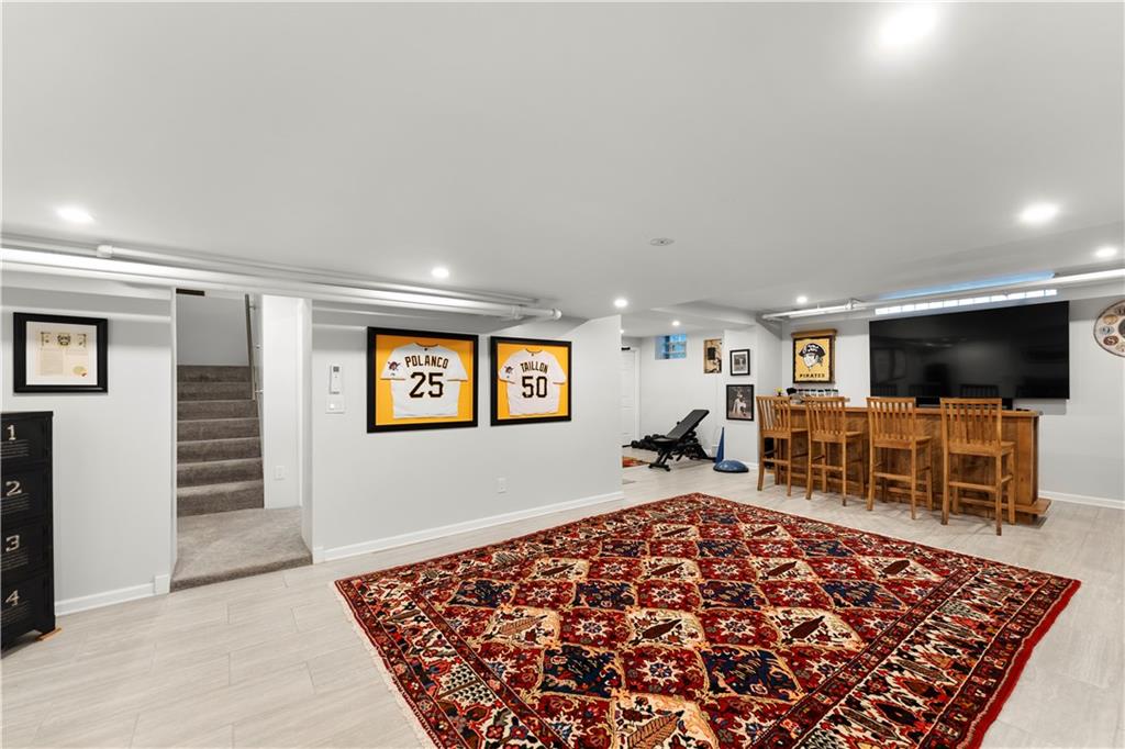 1281 Washington Road Pittsburgh, PA 15228 - Photo 28 of 33 a living room with furniture and a flat screen tv