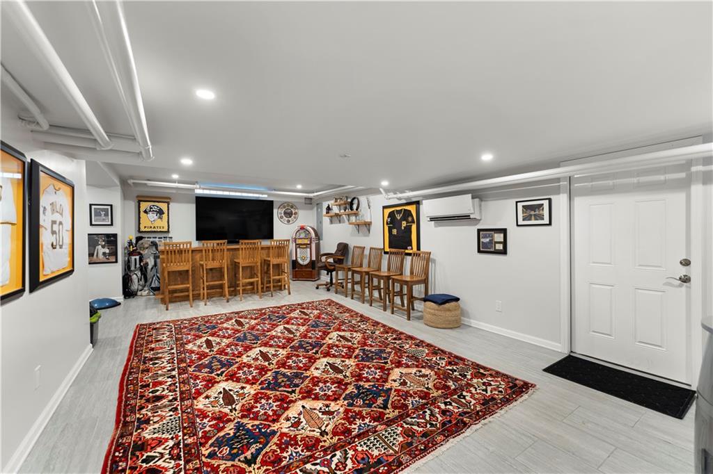 1281 Washington Road Pittsburgh, PA 15228 - Photo 29 of 33 a living room with furniture and a rug