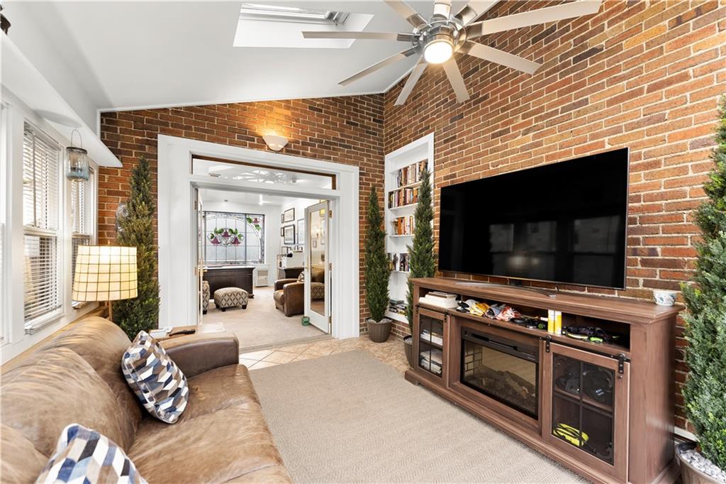 1281 Washington Road Pittsburgh, PA 15228 - Photo 10 of 33 a living room with furniture and a flat screen tv