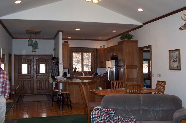186 South Apple River Road Elizabeth, IL 61028 - Photo 5 of 9 a living room with furniture a large window and dining table