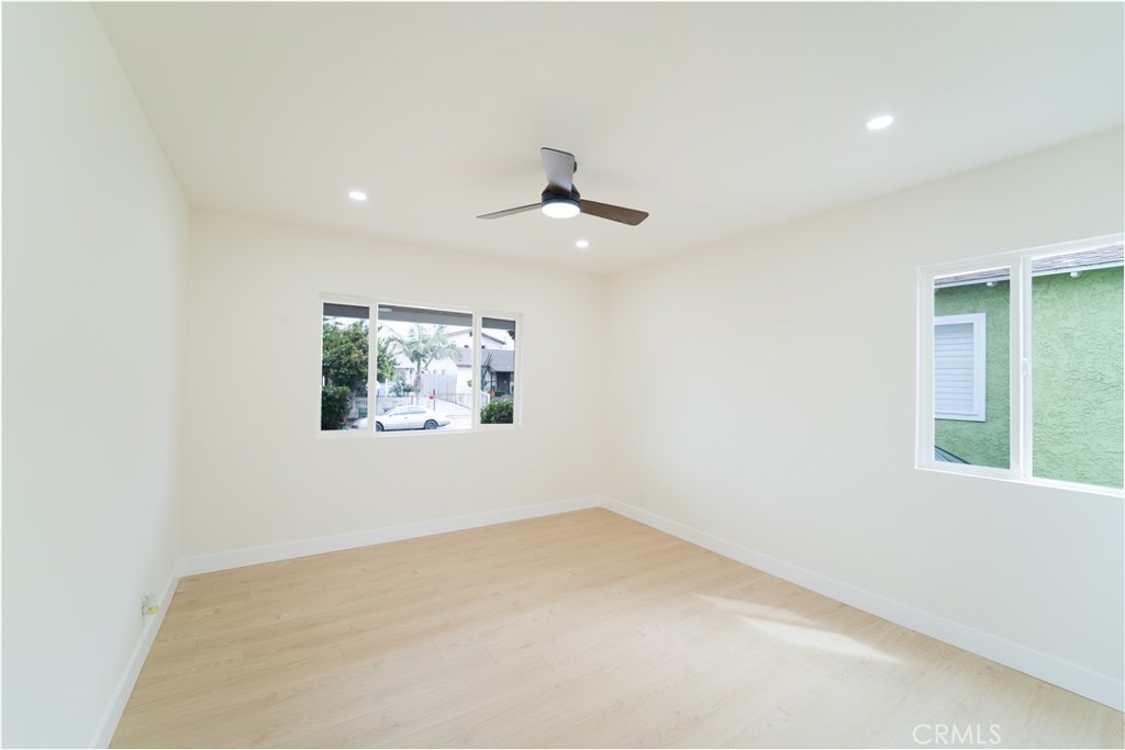 2204 West 153rd Street Compton, CA 90220 - Photo 12 of 21 an empty room with a window and a ceiling fan