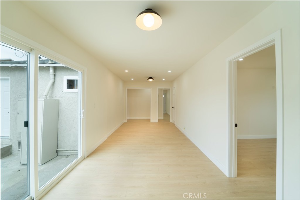 2204 West 153rd Street Compton, CA 90220 - Photo 14 of 21 a view of a hallway with wooden floor
