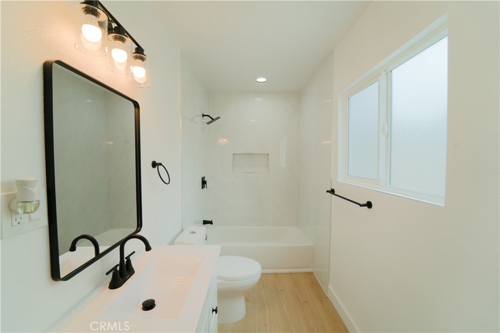 2204 West 153rd Street Compton, CA 90220 - Photo 18 of 21 a bathroom with a sink a toilet and shower