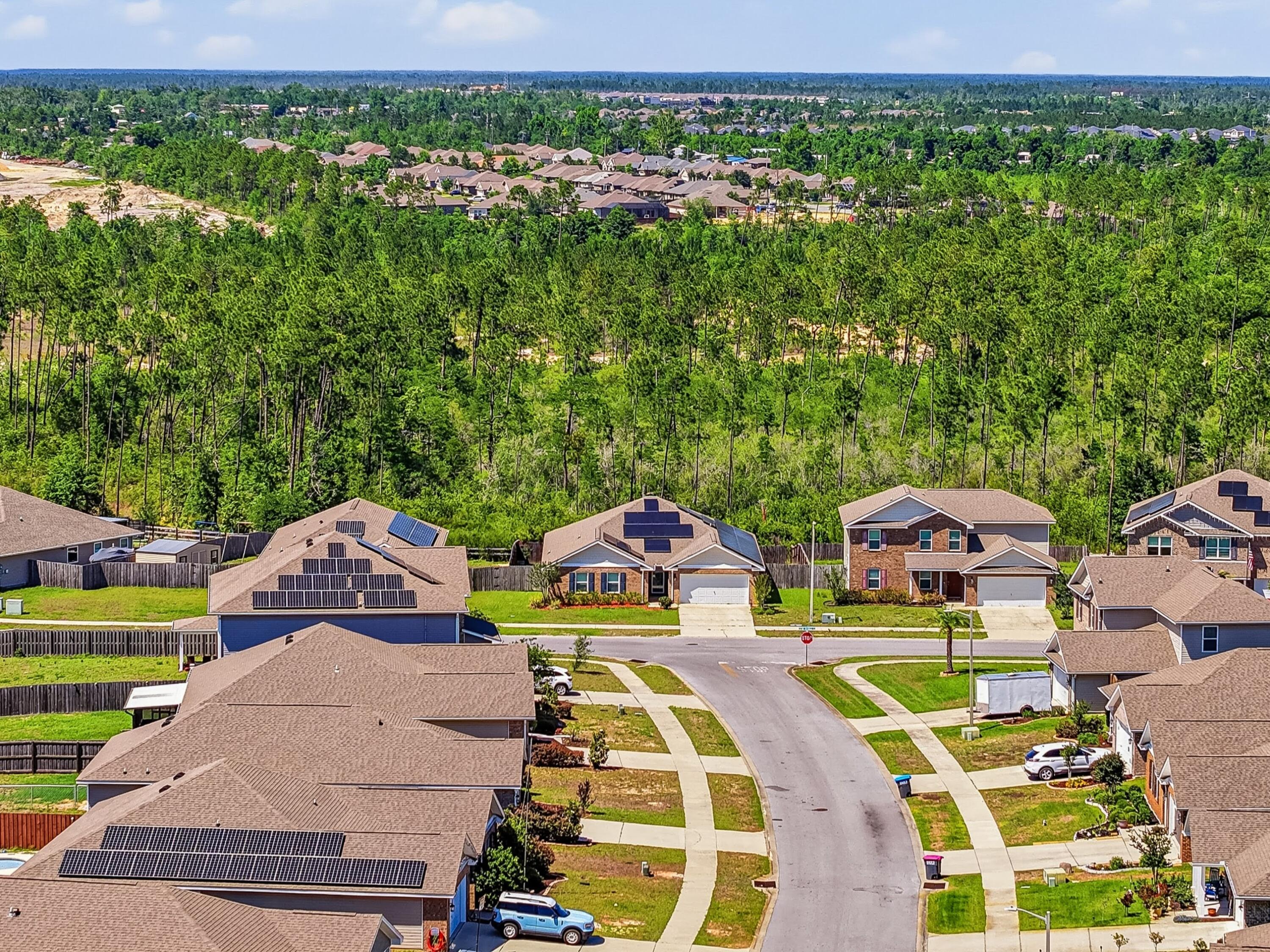 3927 Alva Thomas Road Panama City, FL 32404 - Photo 37 of 46 an aerial view of a yard with swimming pool and outdoor seating