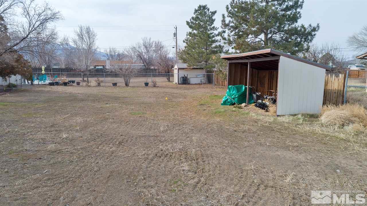 304 River Boat Road Dayton, NV 89403 - Photo 17 of 20 a view of a house with a yard and a large tree