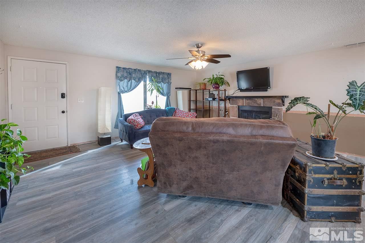 304 River Boat Road Dayton, NV 89403 - Photo 3 of 20 a living room with furniture and a flat screen tv