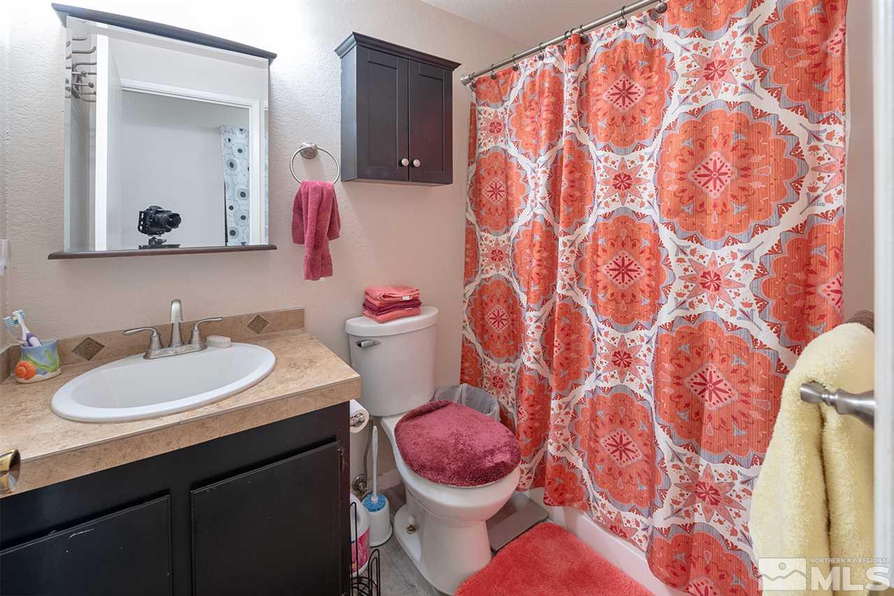 304 River Boat Road Dayton, NV 89403 - Photo 7 of 20 a bathroom with a sink and a mirror
