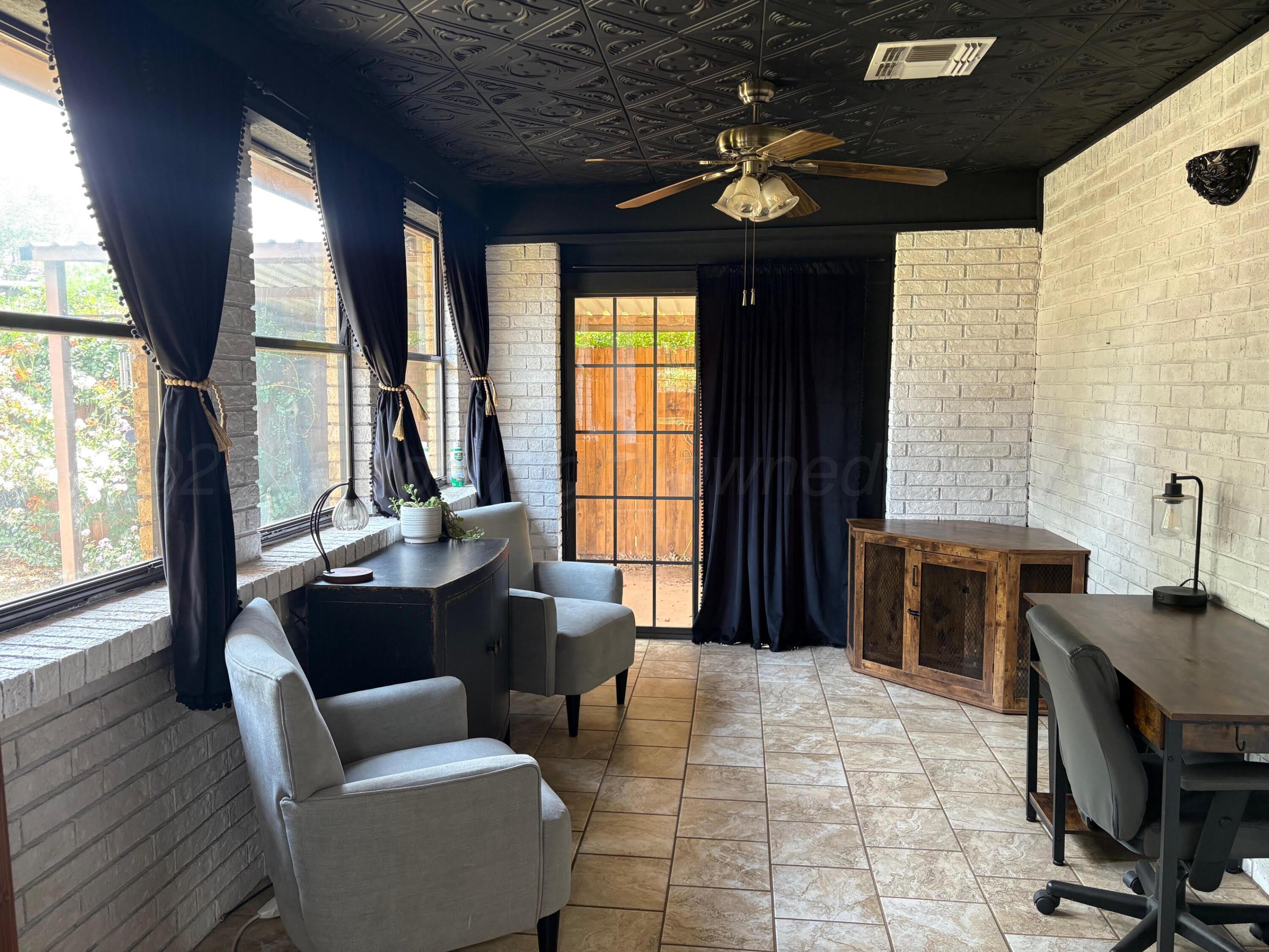 1402 Ave K Northwest Childress, TX 79201 - Photo 20 of 34 a living room with furniture and a large window