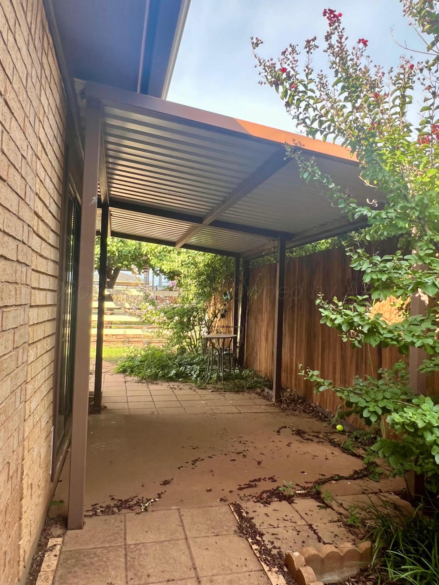 1402 Ave K Northwest Childress, TX 79201 - Photo 23 of 34 a view of a porch and a yard