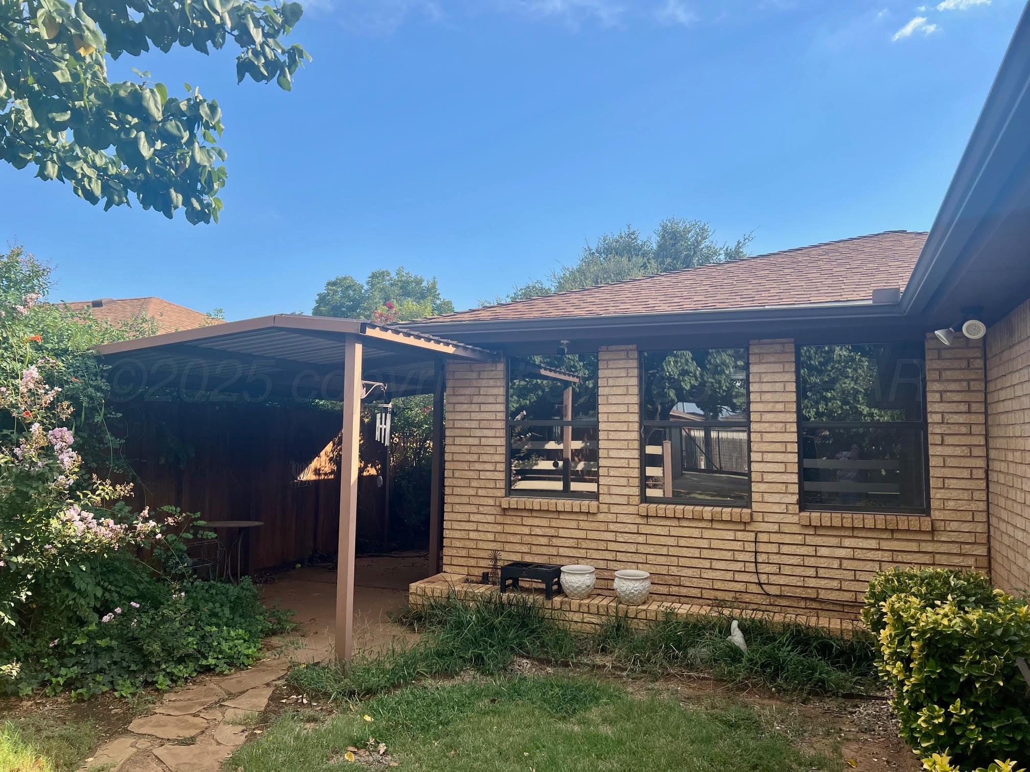 1402 Ave K Northwest Childress, TX 79201 - Photo 25 of 34 a front view of a house with garden
