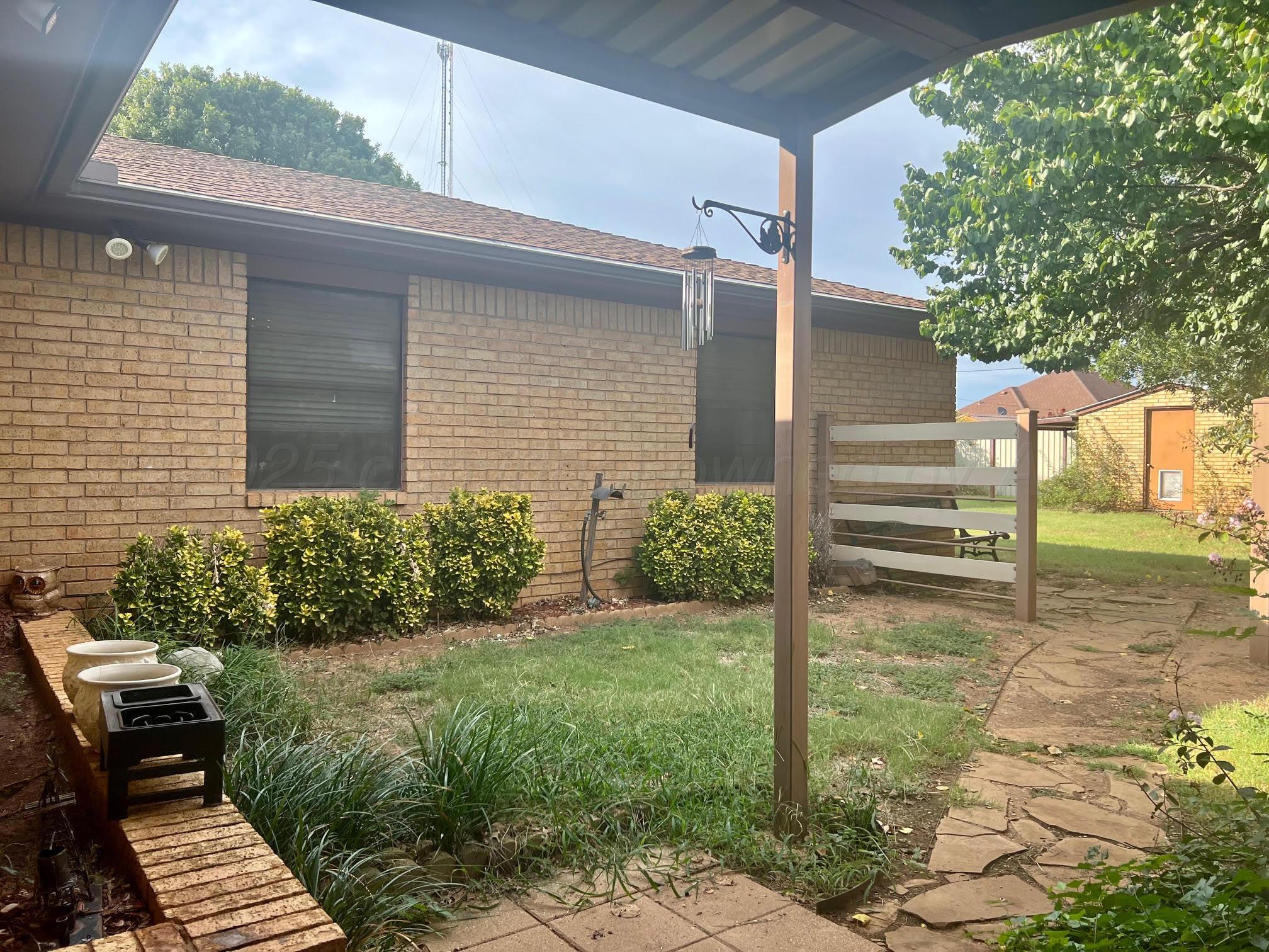 1402 Ave K Northwest Childress, TX 79201 - Photo 26 of 34 a view of a backyard with sitting area