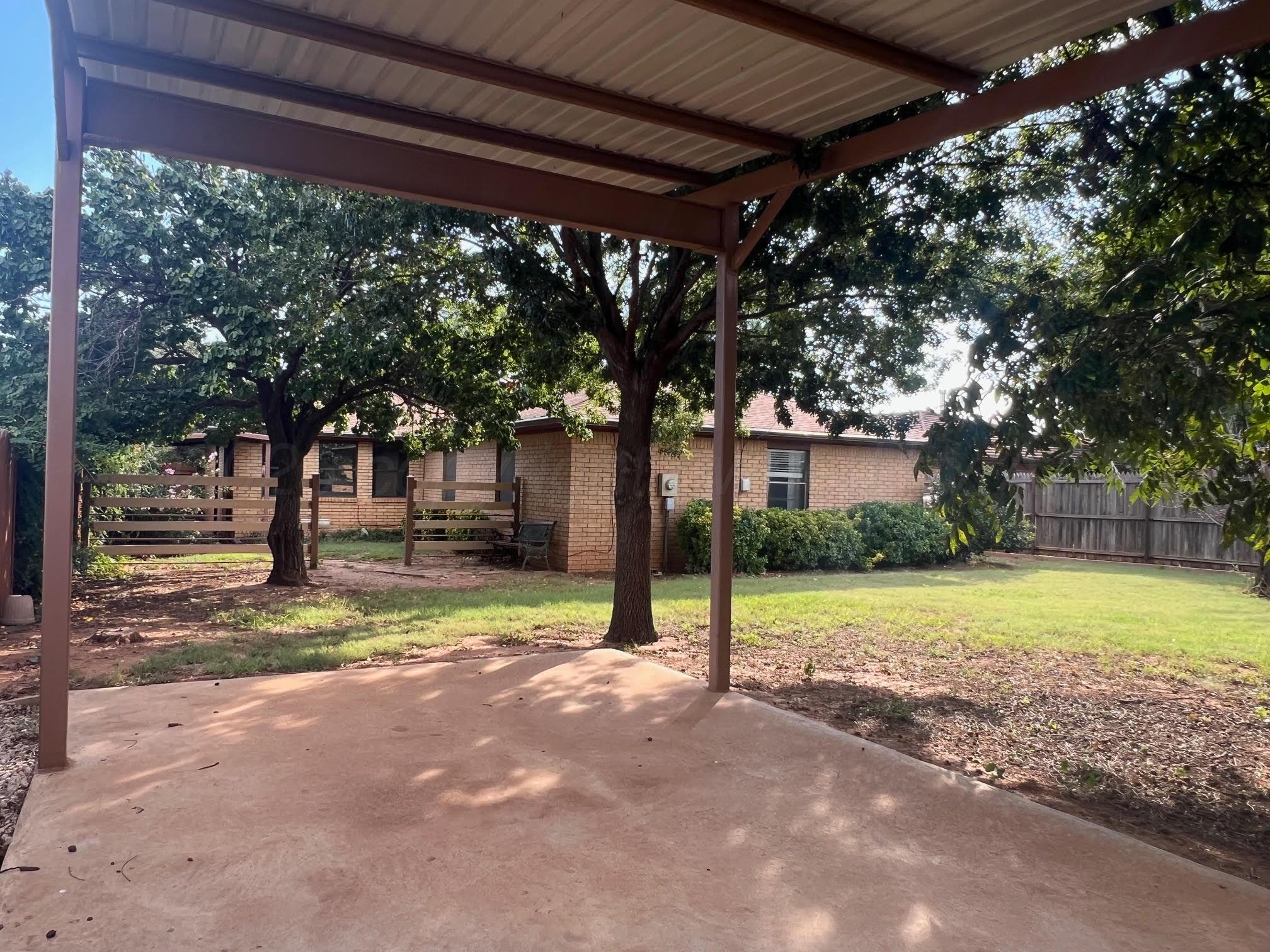 1402 Ave K Northwest Childress, TX 79201 - Photo 28 of 34 a view of a house with backyard and tree