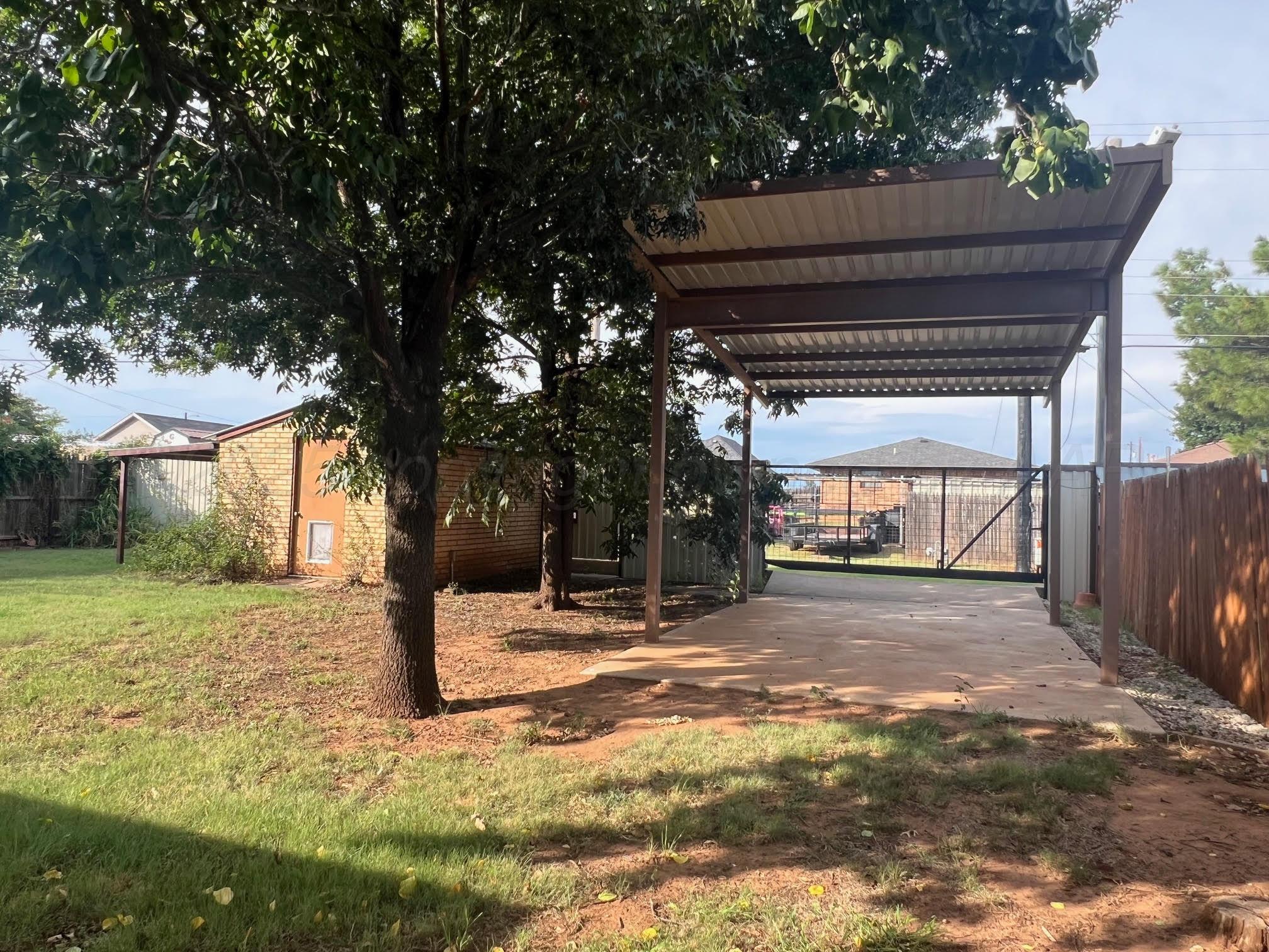 1402 Ave K Northwest Childress, TX 79201 - Photo 30 of 34 a view of a yard with a tree
