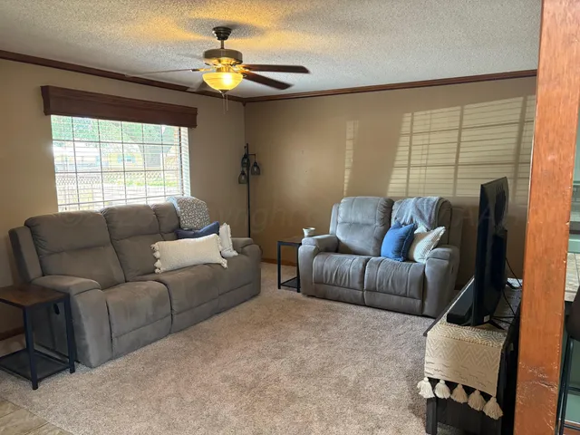 a living room with furniture and a window