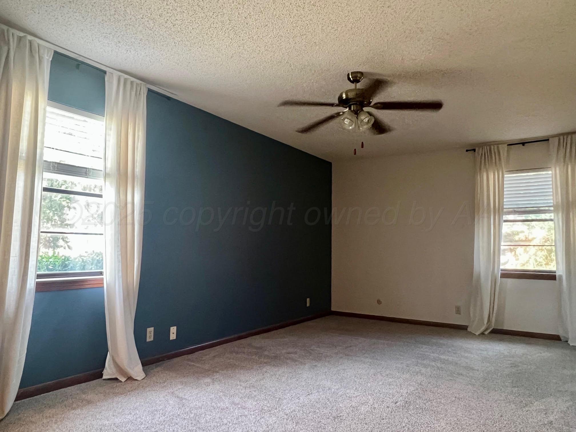 1402 Ave K Northwest Childress, TX 79201 - Photo 9 of 34 a view of an empty room with a window