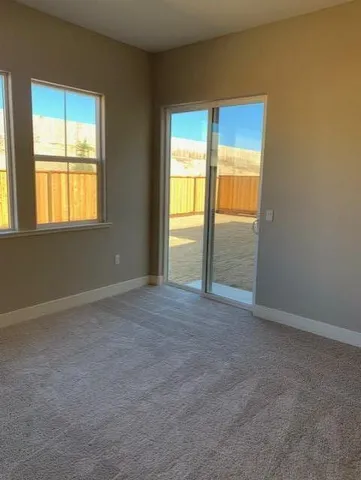 an empty room with a empty space and a window