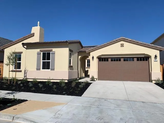 a front view of a house with yard