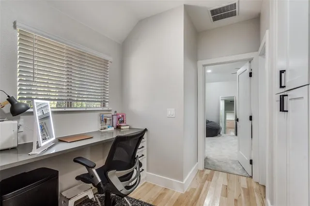 a kitchen with a stove a refrigerator and a fireplace