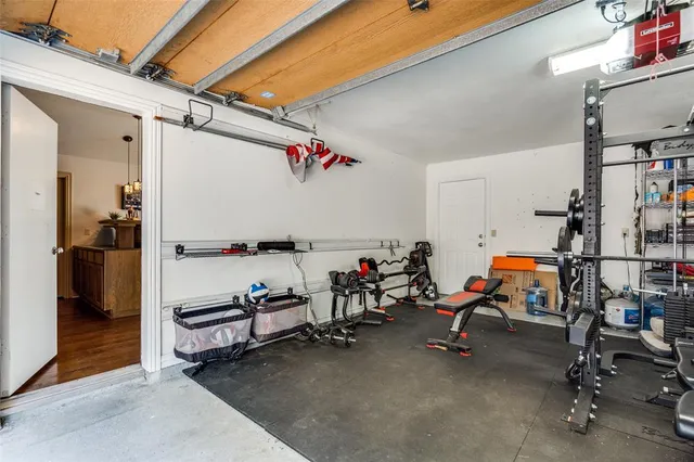 a front view of a house with swimming pool having outdoor seating