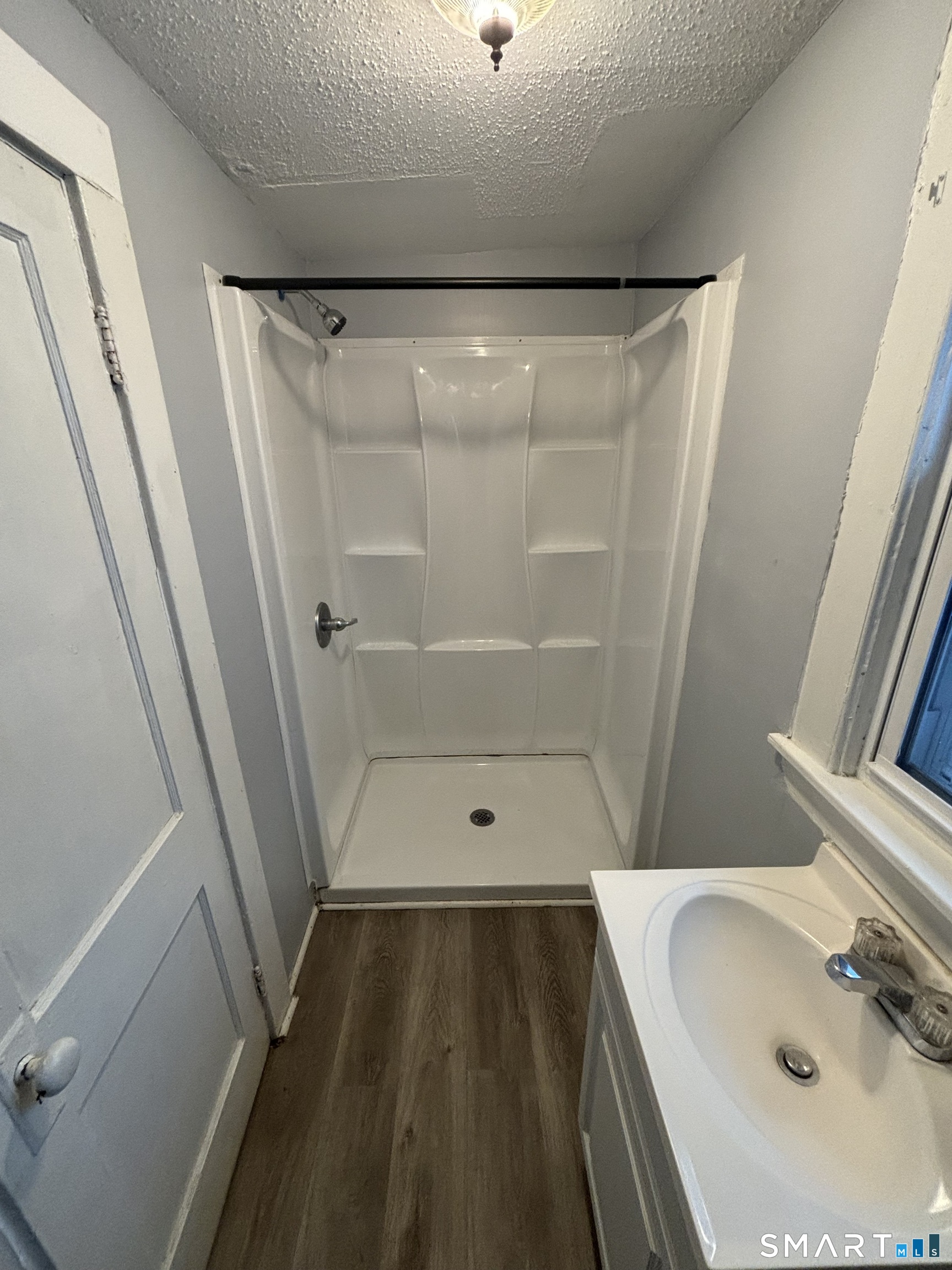 126 Main Street Terryville, CT 06786 - Photo 12 of 14 a bathroom with a sink and a mirror